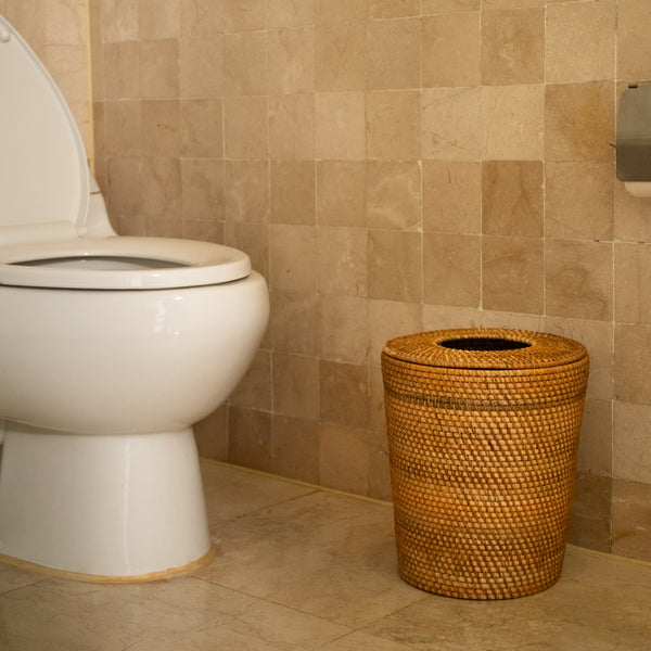 Round dustbin with hole in lid, front view