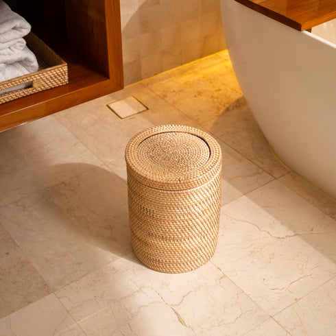 Woven rattan bin with rotating lid, top-down view showing the round woven lid