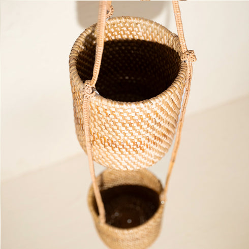 Double tier rattan hanging planter viewed from above showing two stacked woven plant pots