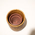 Natural rattan plant pot terracotta insert saucer top view