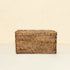 Dark brown rattan toilet roll storage box close up handwoven