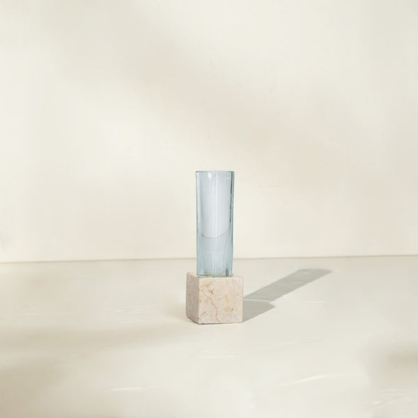 Single marble propagation vase with one clear glass test tube on a neutral surface