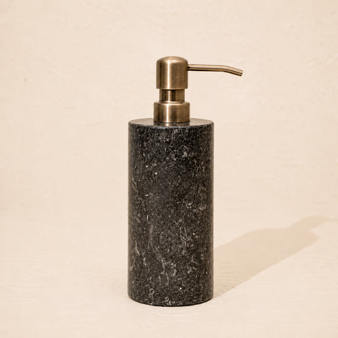 Black marble soap dispenser with antique brass metal pump