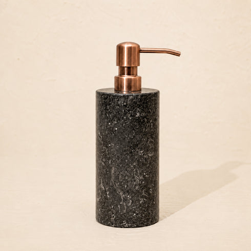 Black marble soap dispenser with antique copper metal pump