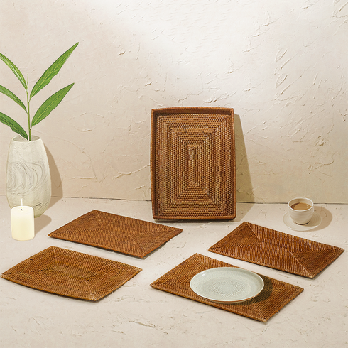 Honey brown rectangular rattan placemats with holder close up