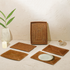 Honey brown rectangular rattan placemats with holder close up
