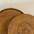 Honey brown round rattan placemats with holder close up