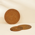Honey brown round rattan placemats with holder texture detail