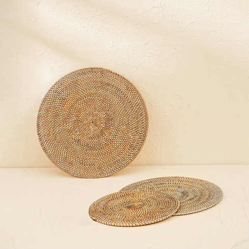 Natural round rattan placemats with holder texture detail