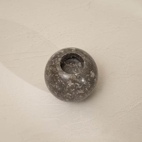 Top down of grey marble tea candle holder