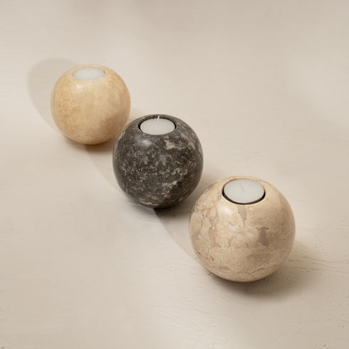 Three marble Sphere tea-light holders showing marble vein
