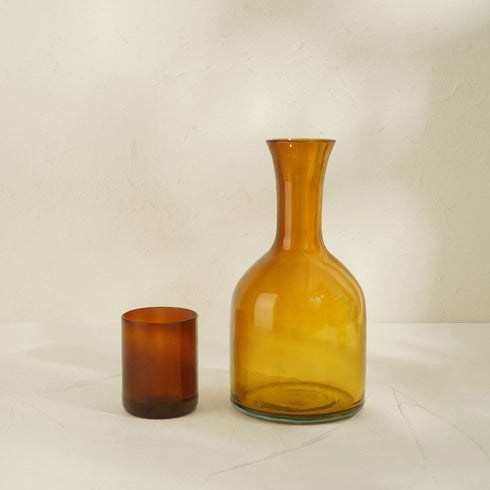 A Carafe Glass along side Tumbler Glass