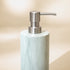 Close-up of Zeolite stone soap dispenser with brushed steel pump