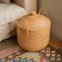 Rattan basket with lid and handles for storage by sofa