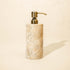 Beige marble soap dispenser with antique brass metal pump