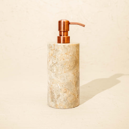 Beige marble soap dispenser with antique copper metal pump
