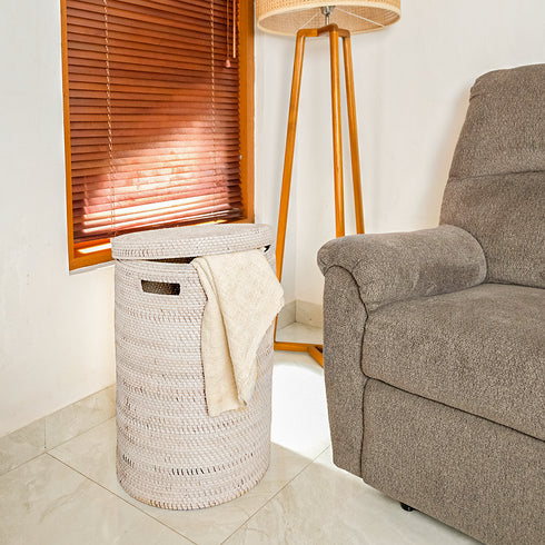 White rattan laundry basket with blanket storage