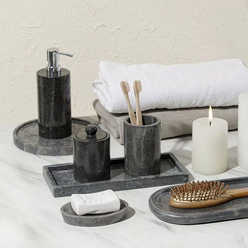 Black marble bathroom accessories set close up