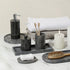 Black marble bathroom accessories set close up