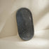 Black marble bathroom accessories set lifestyle
