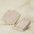 White wash rectangular rattan placemats with holder styled