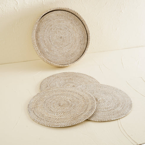 White wash round rattan placemats with holder close up