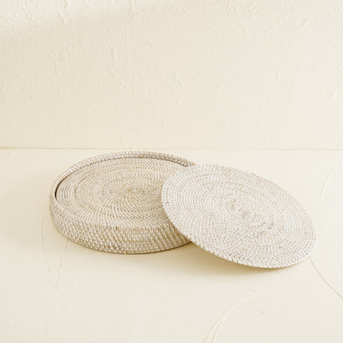 White wash round rattan placemats styled on dining table