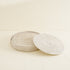 White wash round rattan placemats styled on dining table