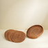 Honey brown oval rattan placemats with holder texture