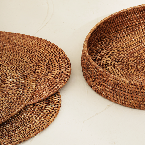 Honey brown oval rattan placemats with holder styled