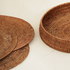 Honey brown oval rattan placemats with holder styled