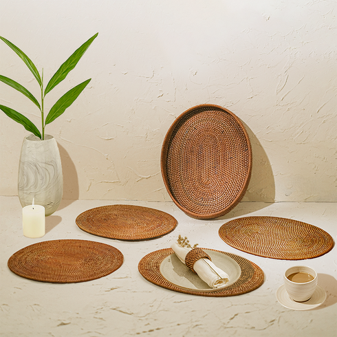Honey brown oval rattan placemats with holder close up