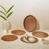 Honey brown oval rattan placemats with holder close up