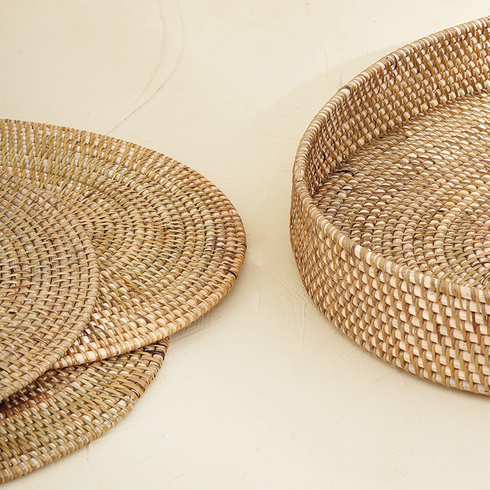 Natural oval rattan placemats with holder styled