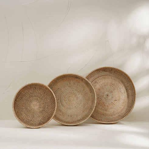 Three natural wicker trays in three sizes