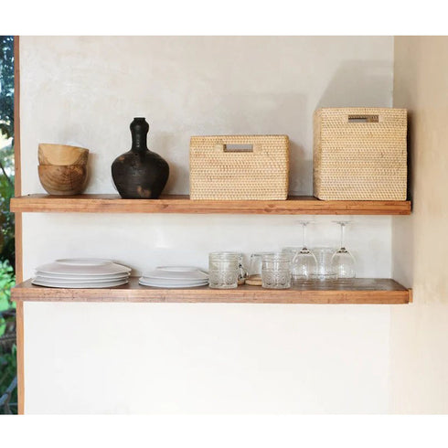 Rattan baskets on shelf