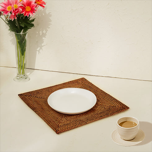 Large square placemat in honey brown with a plate