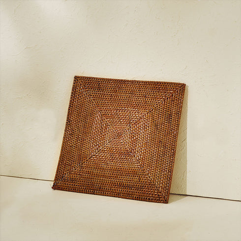 Handwoven table mat in honey brown
