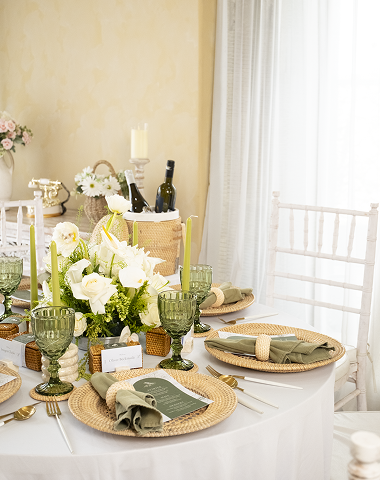 Wedding table styled with rattan and marble decor