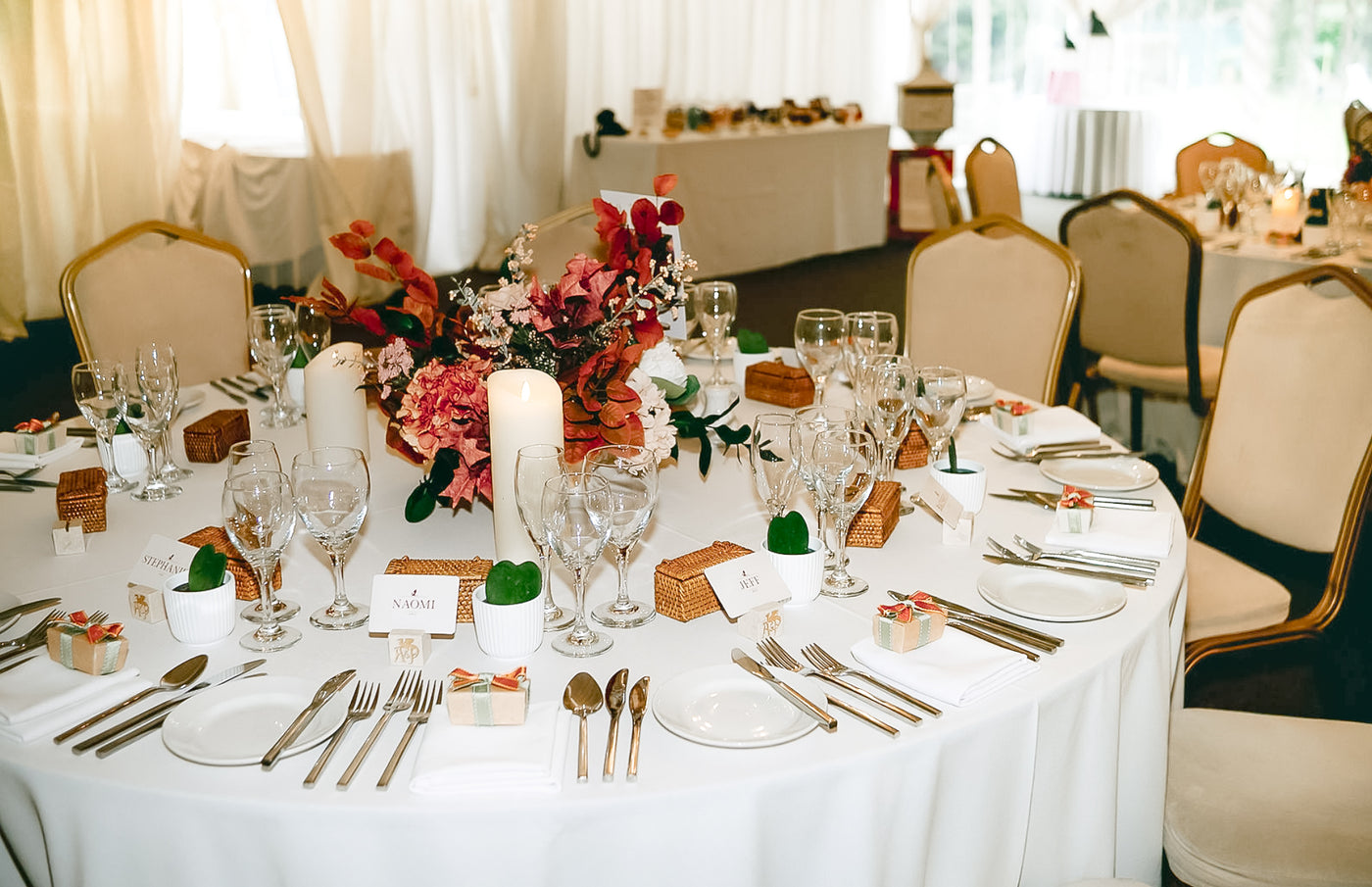 Close up of wedding table detail with rattan and marble